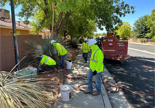 Workers installing utility lines.